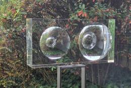 Vaclav Cigler (Vsetín CZ, 1929 - Prague CZ, 2026), Lens (Block with Two Windows), Unique piece, Prague, 1961-67, Cast and hand-ground clear optical glass, metal stand designed by the artist